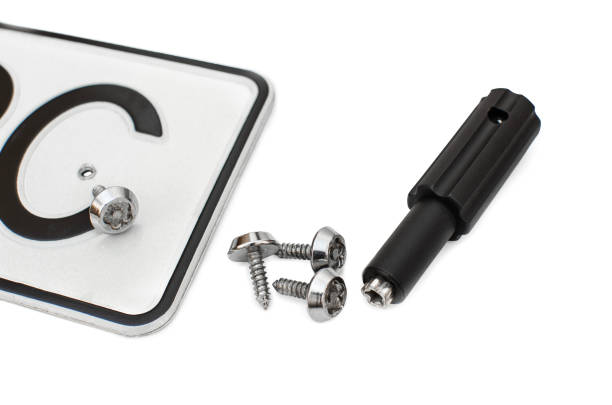 Tamper-resistant screws and specialized tool for securing license plate frames.